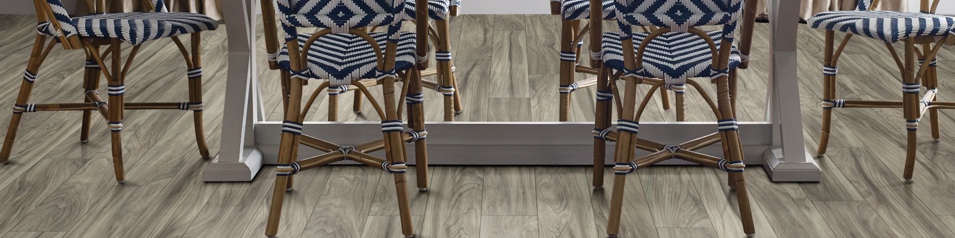 woven dining chairs around a dining table - from Carpet and Tile Junction