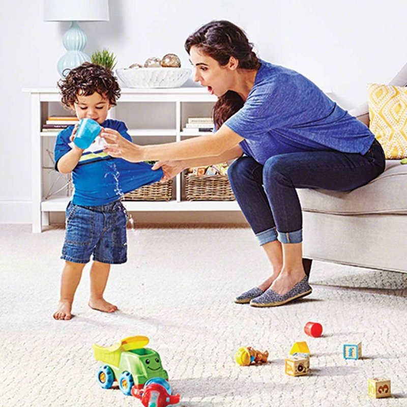 Mother and kid playing with water from Carpet and Tile Junction in Apache Junction, AZ