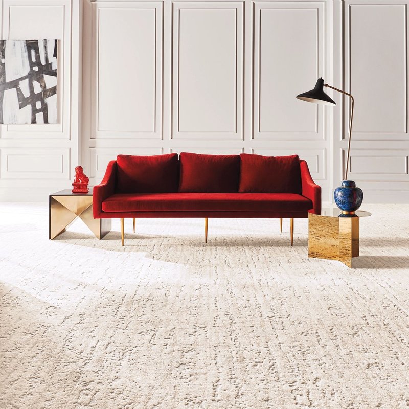 red sofa on carpet floor from Carpet and Tile Junction in Apache Junction, AZ